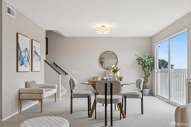 316 Gold Mine Dr, San Francisco, CA 94131 - dining space with baseboards, visible vents, and light carpet