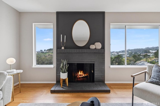 316 Gold Mine Dr, San Francisco, CA 94131 - living room with a fireplace, plenty of natural light, and baseboards