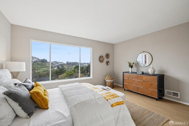316 Gold Mine Dr, San Francisco, CA 94131 - bedroom featuring light wood finished floors, visible vents, and baseboards