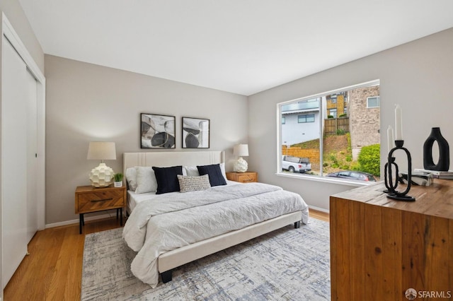 316 Gold Mine Dr, San Francisco, CA 94131 - bedroom featuring baseboards, wood finished floors, and a closet