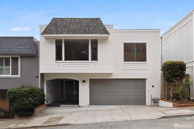 316 Gold Mine Dr, San Francisco, CA 94131 - view of front of house with concrete driveway, a shingled roof, an attached garage, and stucco siding