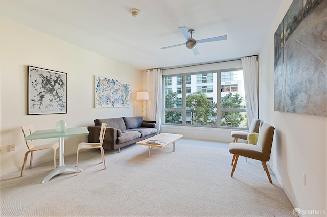 carpeted living room featuring ceiling fan