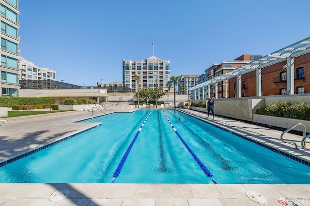 view of pool featuring a patio area