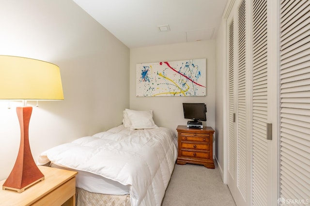 bedroom featuring light colored carpet