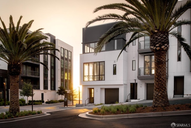 view of outdoor building at dusk