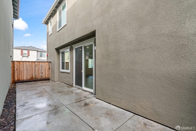 view of property exterior with a patio