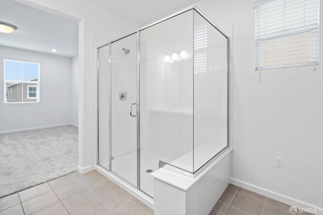 bathroom featuring tile patterned flooring and a shower with door