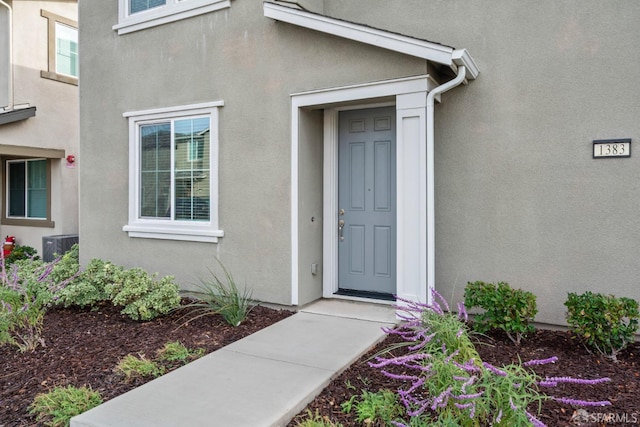 doorway to property with central air condition unit