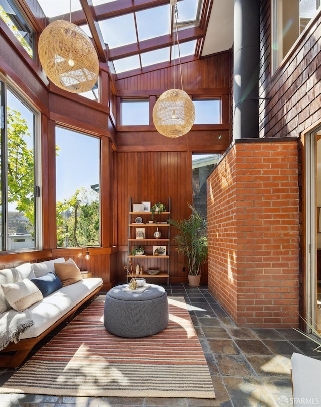 sunroom featuring vaulted ceiling