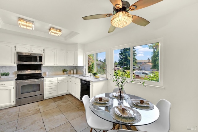 1723 Astoria Dr, Fairfield, CA 94534 - kitchen featuring appliances with stainless steel finishes, backsplash, a raised ceiling, light countertops, and light tile patterned flooring