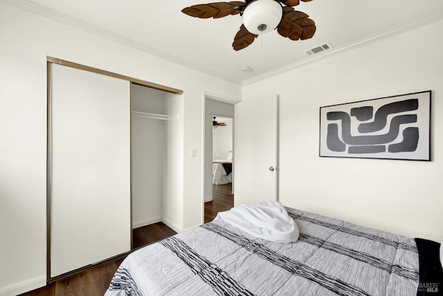 1723 Astoria Dr, Fairfield, CA 94534 - bedroom featuring a closet, crown molding, dark wood-type flooring, and ceiling fan