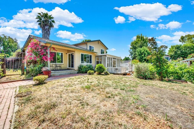 1723 Astoria Dr, Fairfield, CA 94534 - back of house featuring stucco siding and a sunroom