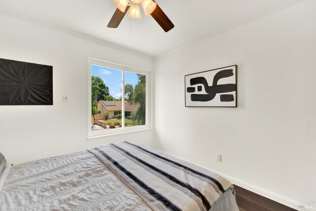 1723 Astoria Dr, Fairfield, CA 94534 - bedroom featuring dark wood-type flooring, ornamental molding, and a ceiling fan