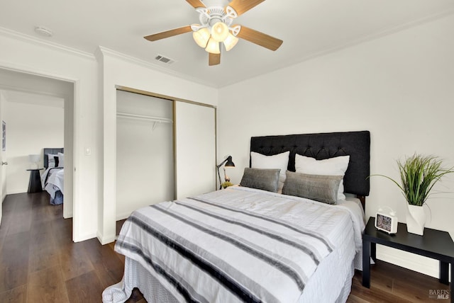 1723 Astoria Dr, Fairfield, CA 94534 - bedroom featuring a closet, crown molding, dark wood finished floors, and a ceiling fan