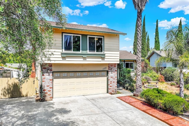 1723 Astoria Dr, Fairfield, CA 94534 - view of front of home featuring brick siding, driveway, an attached garage, and a shingled roof