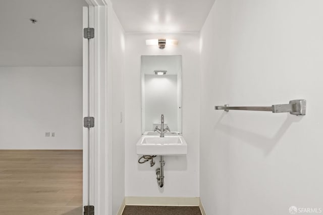 bathroom featuring sink and hardwood / wood-style flooring