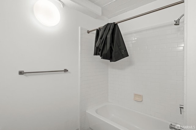 bathroom featuring shower / tub combo with curtain