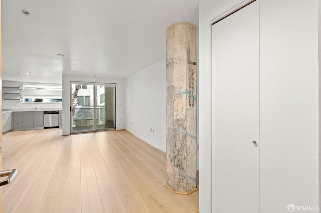 unfurnished living room featuring light wood-type flooring