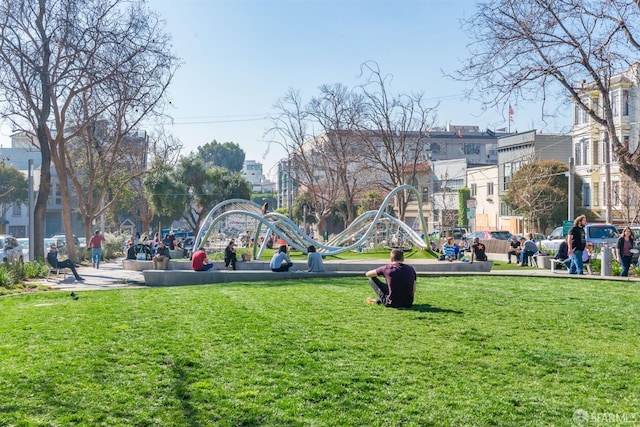 view of community with playground community and a lawn