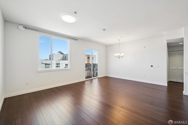 50 Jerrold Ave Unit 305, San Francisco, CA 94124 - unfurnished room with a chandelier, baseboards, and dark wood-style flooring
