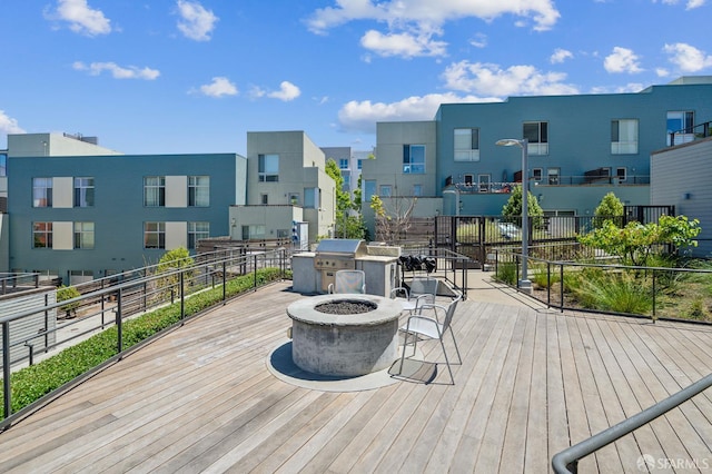 50 Jerrold Ave Unit 305, San Francisco, CA 94124 - wooden terrace featuring a fire pit and a residential view