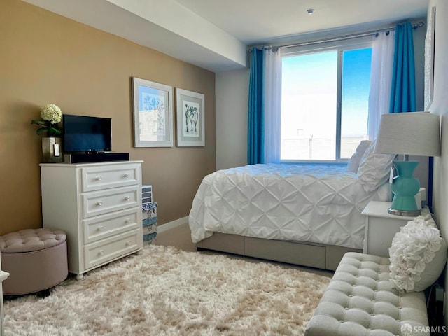 bedroom featuring baseboards