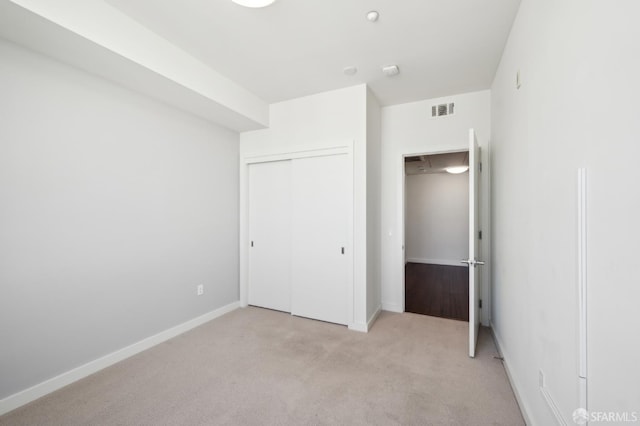 50 Jerrold Ave Unit 305, San Francisco, CA 94124 - unfurnished bedroom with light colored carpet, a closet, and baseboards