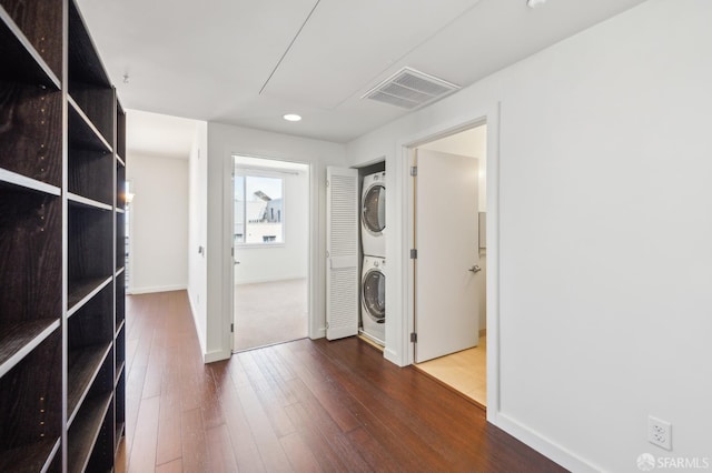 50 Jerrold Ave Unit 305, San Francisco, CA 94124 - laundry room featuring stacked washer and clothes dryer, wood-type flooring, recessed lighting, and baseboards
