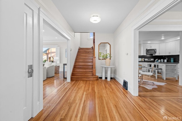 foyer featuring light wood-type flooring