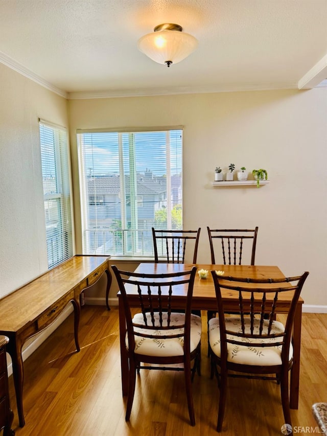 15 Mateo Ave Unit 7, Millbrae, CA 94030 - dining area with baseboards, a textured ceiling, light wood-style floors, and ornamental molding
