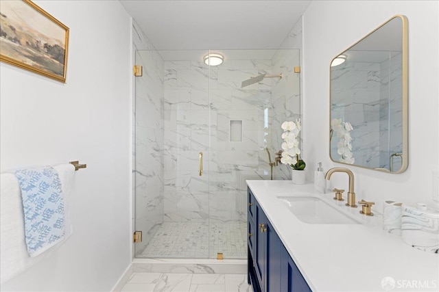 full bathroom with marble finish floor, baseboards, vanity, and a marble finish shower