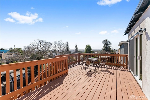 wooden deck with outdoor dining space