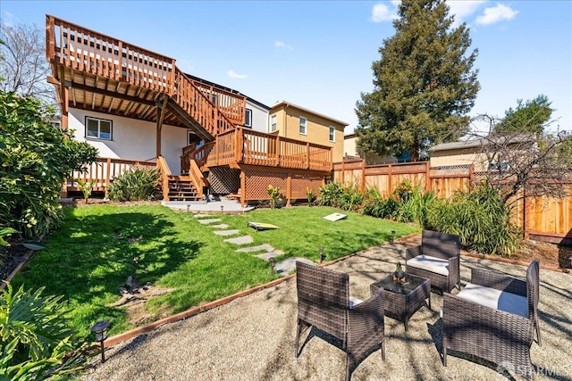 view of yard with stairway, fence private yard, a patio area, and a deck