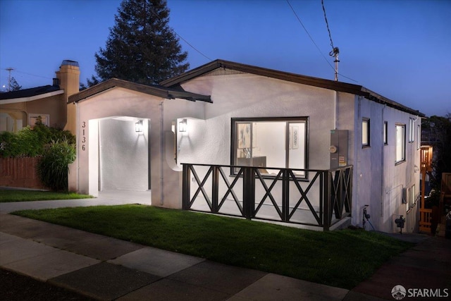 view of front of property featuring stucco siding