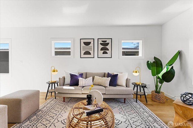 living room with light wood-style floors and baseboards