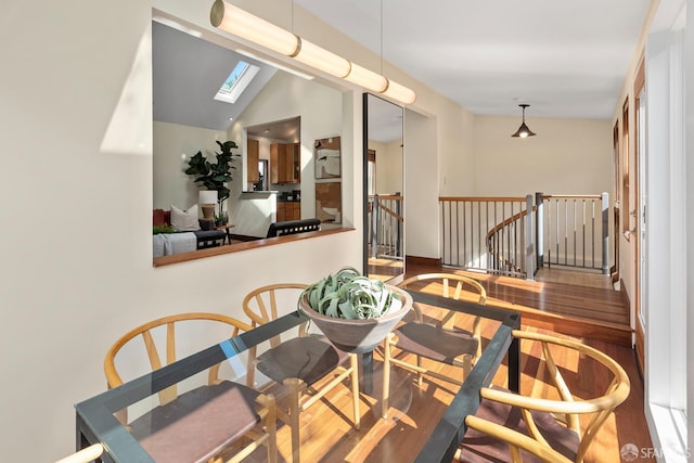 762 Bay St, San Francisco, CA 94109 - dining room with wood finished floors, a skylight, lofted ceiling, and baseboards