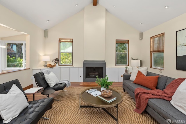 762 Bay St, San Francisco, CA 94109 - living room with wood finished floors, plenty of natural light, high vaulted ceiling, a fireplace with raised hearth, and beam ceiling