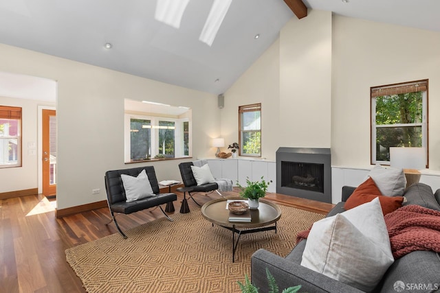 762 Bay St, San Francisco, CA 94109 - living area featuring wood finished floors, beamed ceiling, plenty of natural light, high vaulted ceiling, and a fireplace