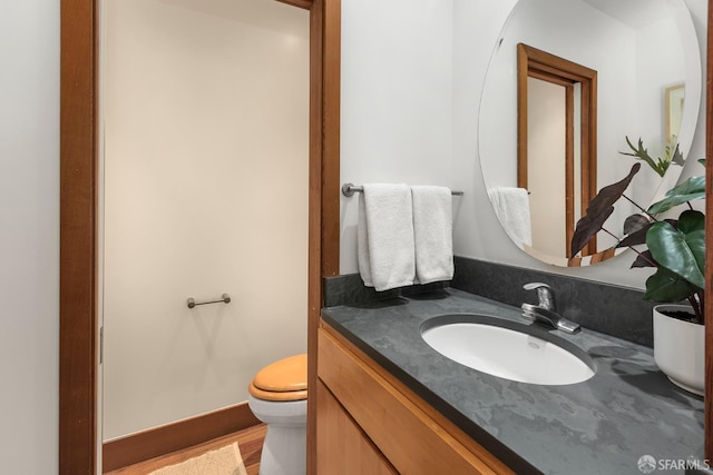 762 Bay St, San Francisco, CA 94109 - bathroom with toilet, vanity, and wood finished floors
