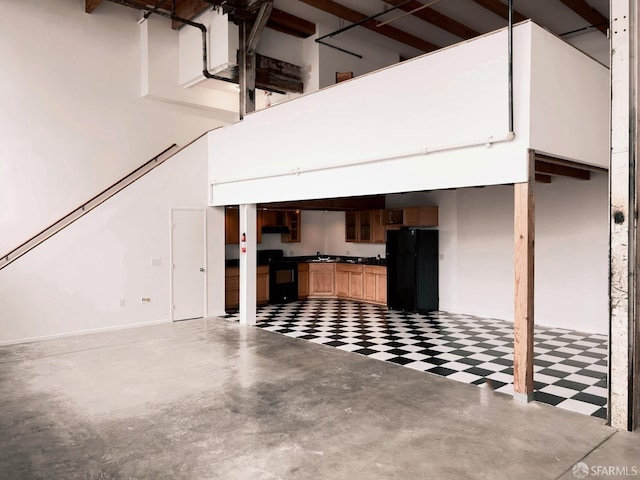 garage featuring black fridge