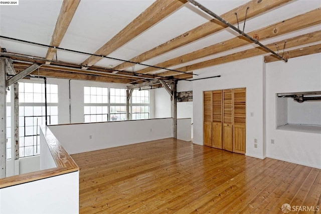 unfurnished living room with wood-type flooring