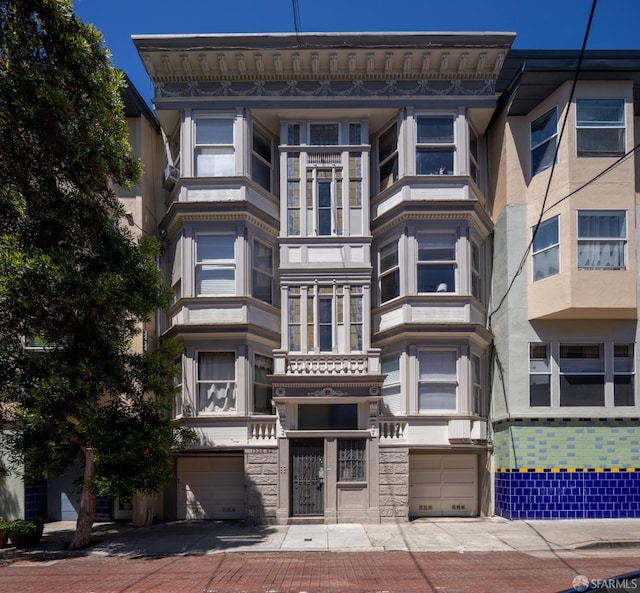 1338 Stevenson St, San Francisco, CA 1906 - view of apartment building / complex featuring an attached garage and driveway