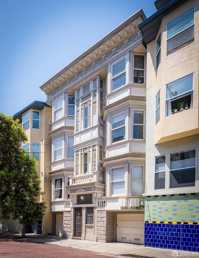 1338 Stevenson St, San Francisco, CA 1906 - view of apartment building / complex featuring an attached garage