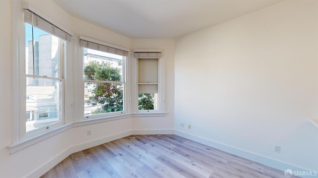 1338 Stevenson St, San Francisco, CA 1906 - unfurnished room with light wood-style flooring and baseboards