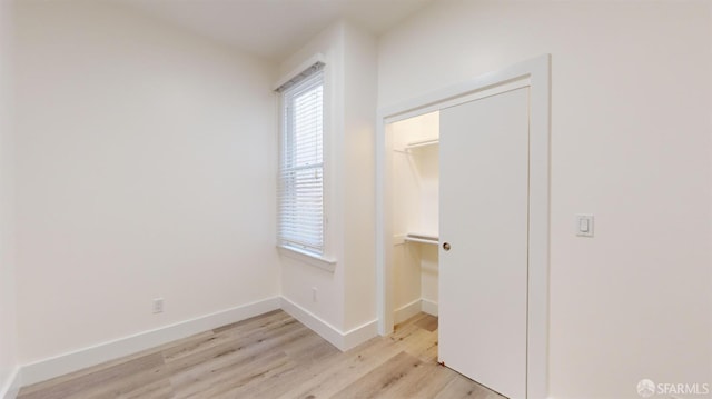 1338 Stevenson St, San Francisco, CA 1906 - unfurnished bedroom with light wood-style floors and a closet