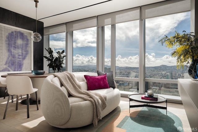 sunroom / solarium featuring a mountain view