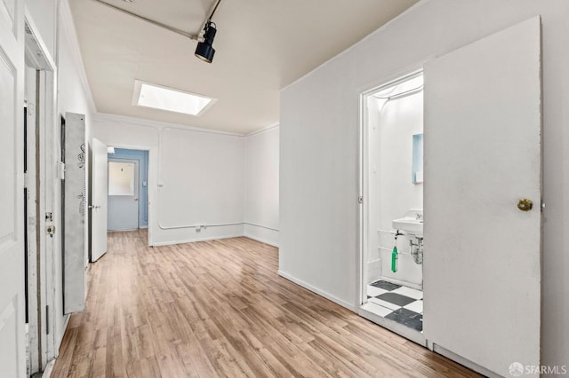 737 Minna St, San Francisco, CA 94103 - corridor featuring light wood-style floors and a skylight