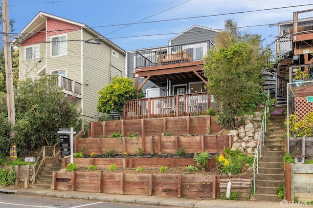 view of front facade with stairway