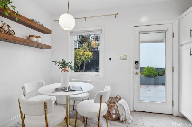 dining room featuring light tile patterned flooring