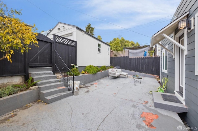 view of patio featuring a gate and fence